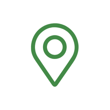 Green location pin icon on a white background, symbolizing GPS navigation and geographical positioning.